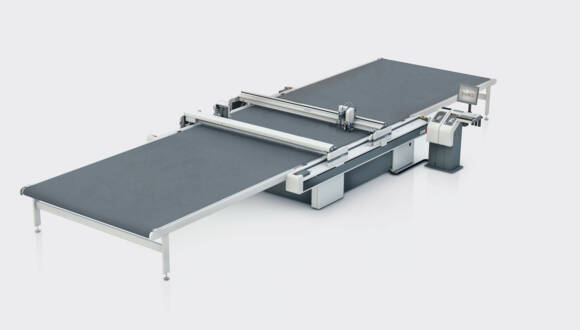 Zünd D3 2XL-3200 digital cutting system with conveyor extension and control unit on a white background. Zünd D3 2XL-3200 digital cutting system with conveyor extension and control unit on a white background.