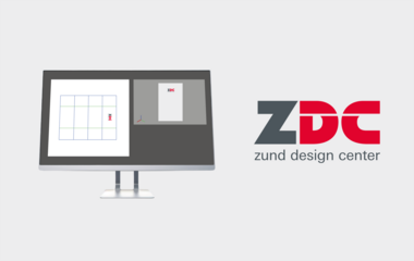 Zünd Design Center software interface on a monitor displays a grid layout and the ZDC logo. Zünd Design Center software interface on a monitor displays a grid layout and the ZDC logo.